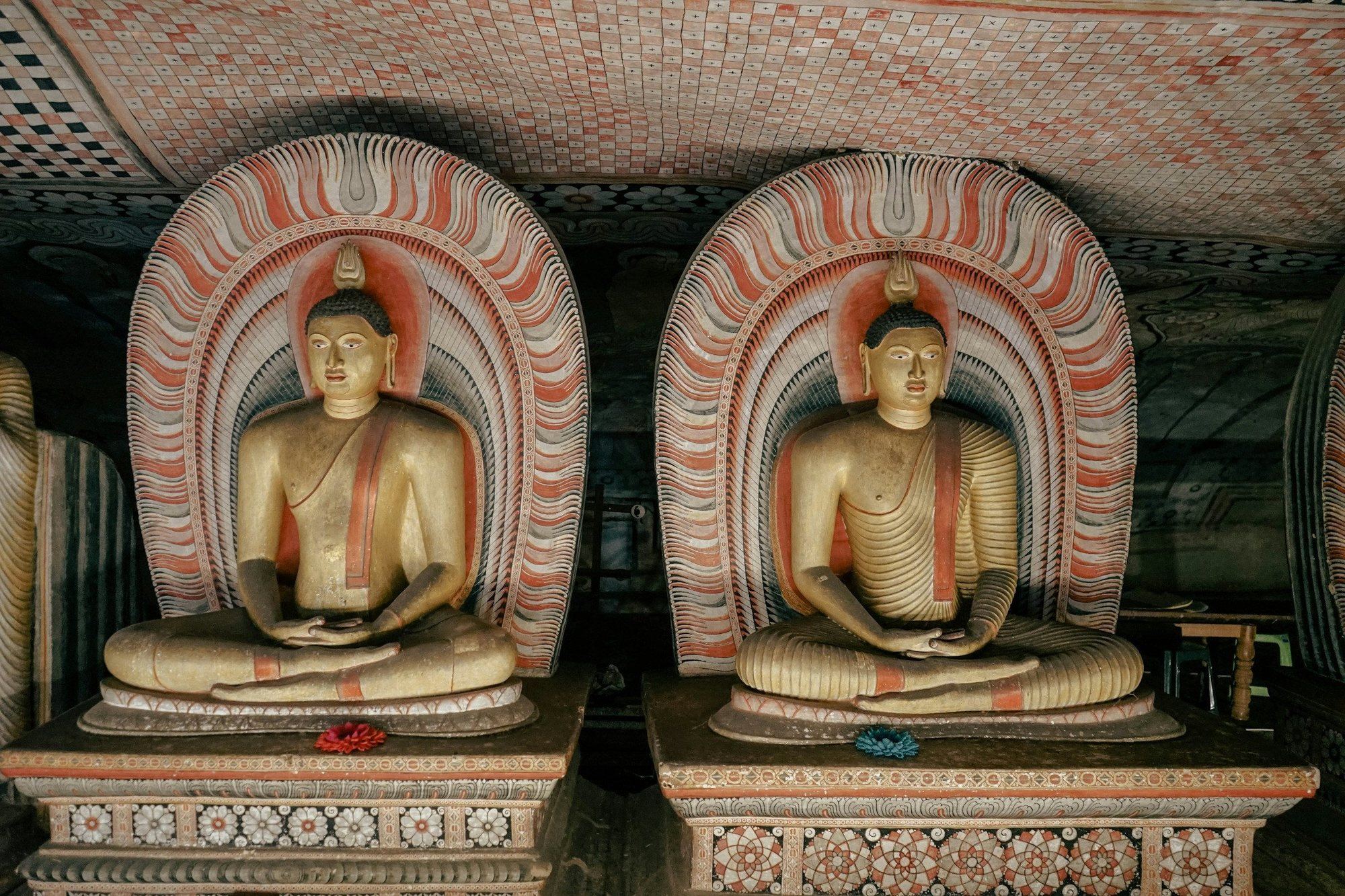 Painted Buddha statues inside the Dambulla cave temple
