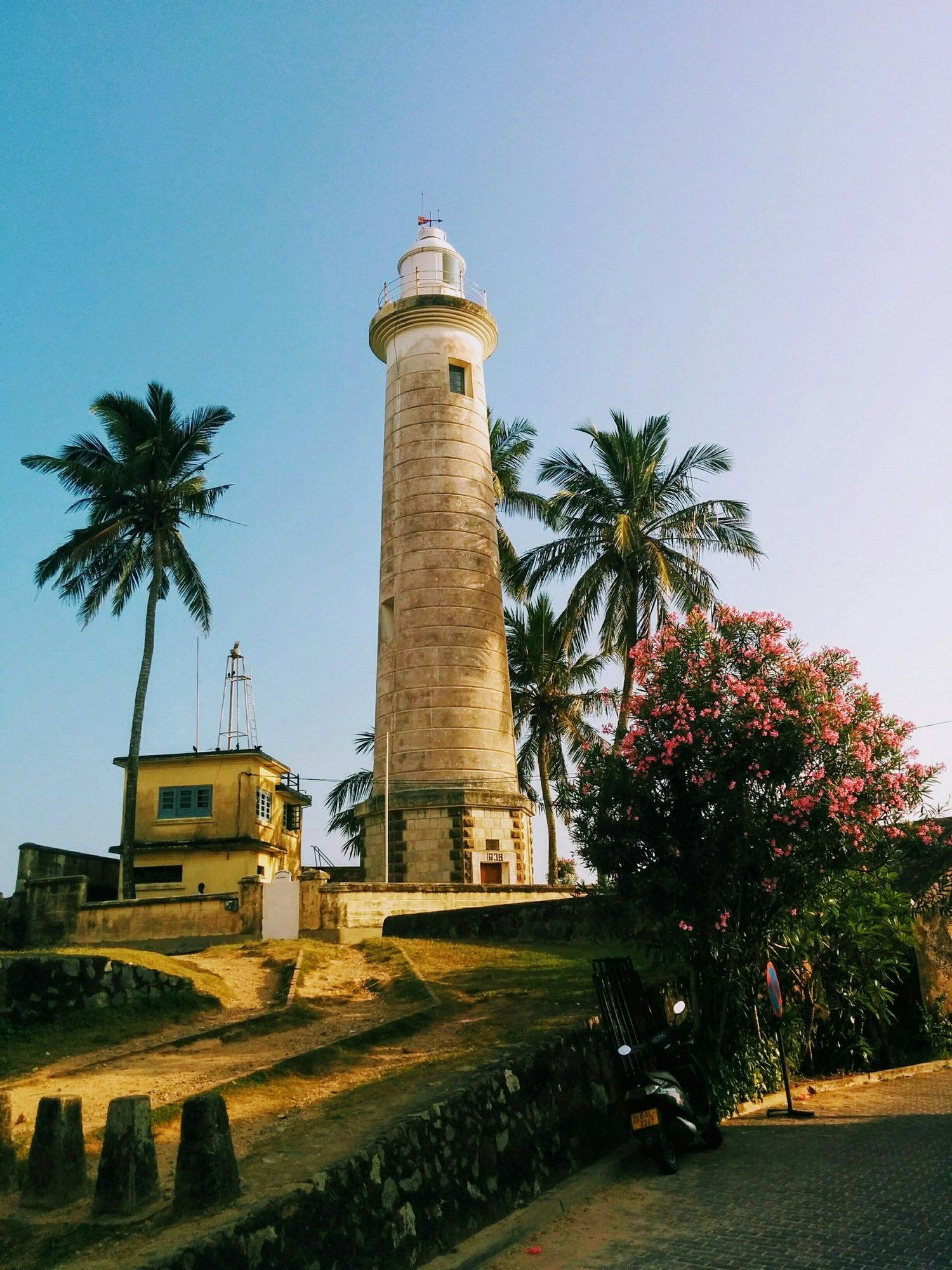 Galle Fort lighthouse among green trees