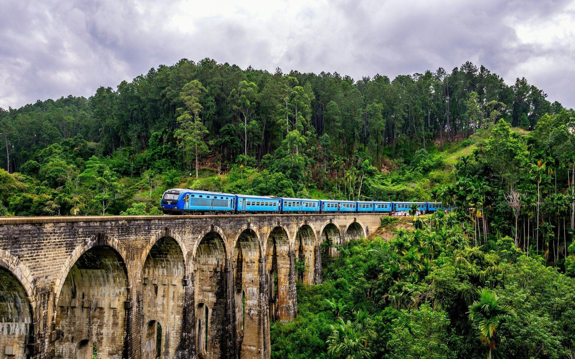 Blue train crossing the Nine Arches Bridge, Ella